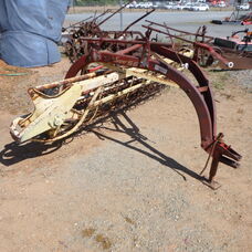 Used New Holland Super 56 roller bar rake