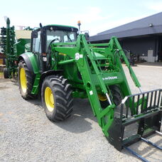 Used John Deere 6520 Cab tractor with front end loader